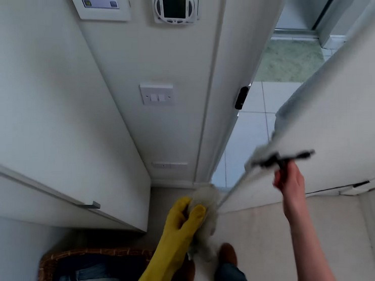 A person opens a door for the second time